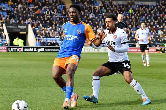 Kevin Berkoe of Shrewsbury Town in action against Walsall