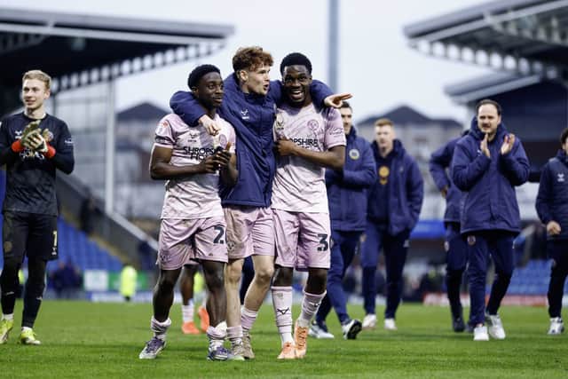 Ismeal Kabia, Tommy McDermott and Kevin Berkoe celebrate the win