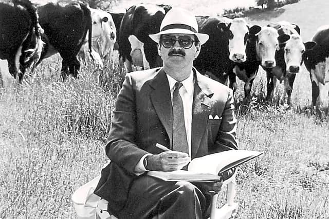 John Cleese sits in a field of cows near Ludlow during the making of the film Clockwise. The original
caption reads: ‘In the fields of deepest south Shropshire, a circus with a difference has set up
camp. It has a very special star who travels in a Mercedes limousine - John Cleese.’