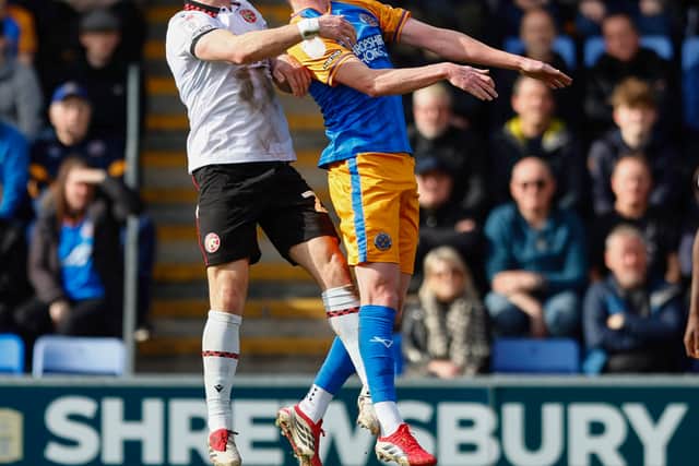 Sam Clucas challenges Walsall's Jamie Jellis (left) for a header
