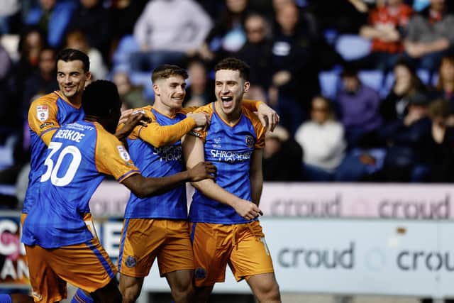 Iwan Morgan celebrates his goal with his Shrewsbury Town team-mates