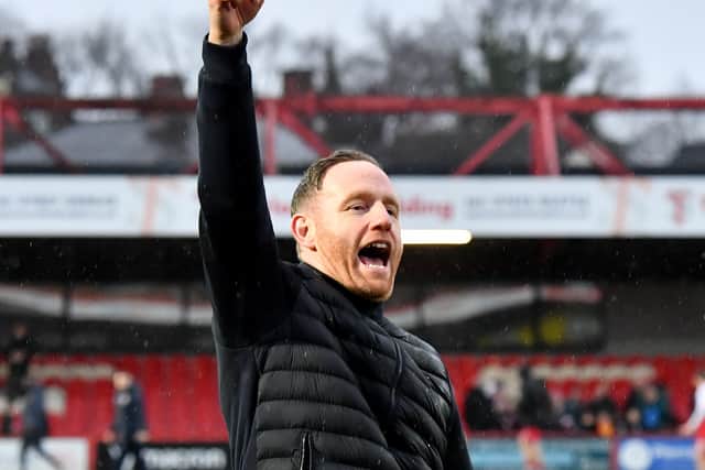 Shrewsbury boss Gavin Cowan celebrates at the final whistle. Picture: Tim Thursfield