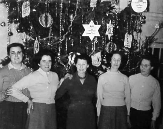 Staff at the Grand cinema, Wellington, in 1959. The page in the scrapbook gives the caption: 'Grand Theatre, Wellington. Pat Turner, Pat Chatham, Anne Weaver (manageress), Hilda Jones, Elsie Royale.' Also the 1959 date. Obviously it must have been around Christmas given the decorations in the background. This picture was shared by Mrs Lynne Purcell, and is another from the collection of her late father Fred Brown.