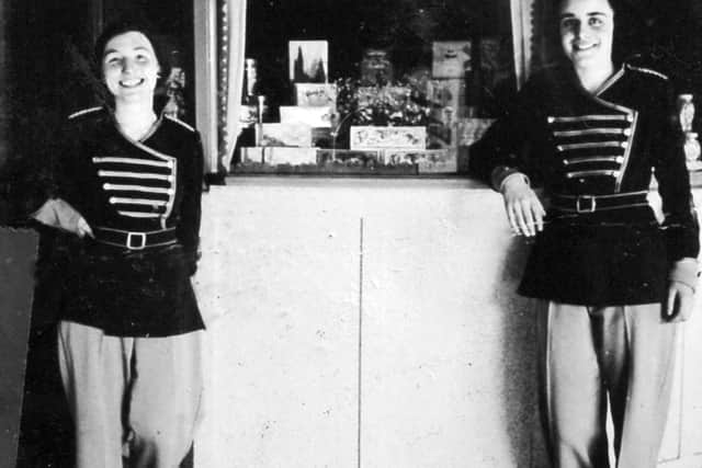 Staff at the Grand cinema, Wellington, in 1938. The page in the scrapbook gives the caption: 'Pat Ford and Mary Taylor.' Also the 1938 date. It also appears in a memories booklet captions: 'Pat and Mary, two members of the Grand staff in the thirties, by the combined sales kiosk and pay box.' This picture was shared by Mrs Lynne Purcell, and is another from the collection of her late father Fred Brown.