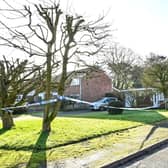Police tape at the scene of the suspected murder of an 84-year-old woman in Prees Higher Heath, near Whitchurch. Photo: Emma Trimble/SWNS