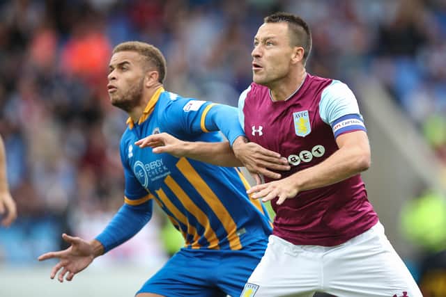 John Terry (right) playing against Shrewsbury Town. Salop's Carlton Morris battles with the England and Chelsea legend. Picture: AMA