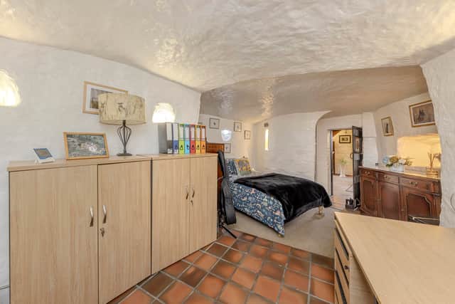 A stunning 16th-century West Midlands cottage built into a carved-out cave has gone on sale