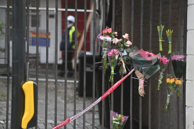 Tributes at the scene of the fatal fire in Shrewsbury town centre. Photo: Steve Leath