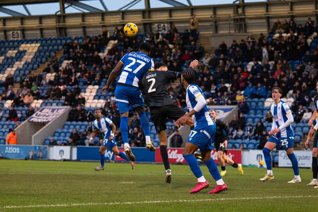 Luca Hoole heads clear. Picture: Ollie Jones