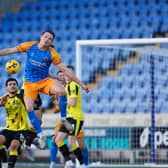 Will Boyle heads clear against Harrogate Town. Picture: Salop Photo