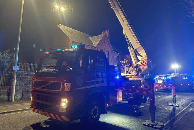Firefighters used the aerial platform to get above the chimney and spray water down the flue. Picture: Market Drayton Fire Station