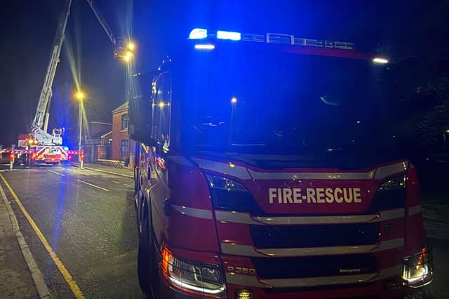 Firefighters used the aerial platform to get above the chimney and spray water down the flue. Picture: Market Drayton Fire Station