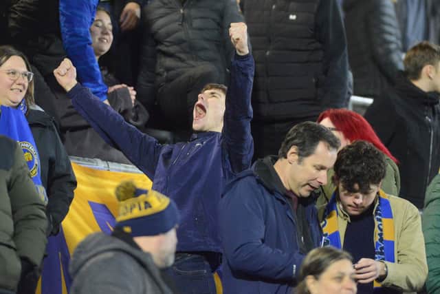 Shrewsbury Town supporters celebrate the victory