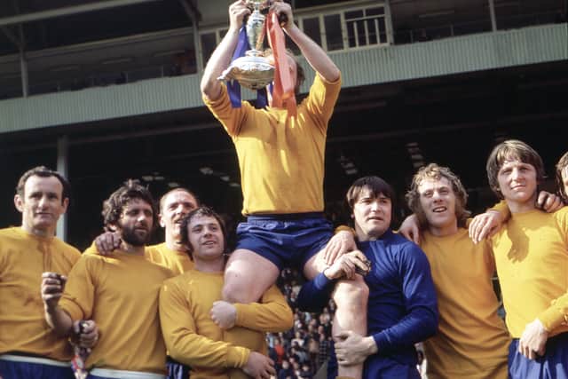 Skipper Graham Carr is chaired on a lap of honour after the Wembley victory 50 years ago.