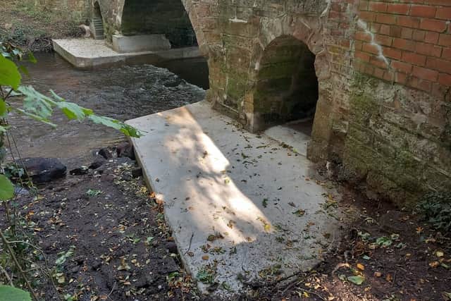 Defective concrete aprons supporting the bridge were removed and replaced to protect its stability and longevity