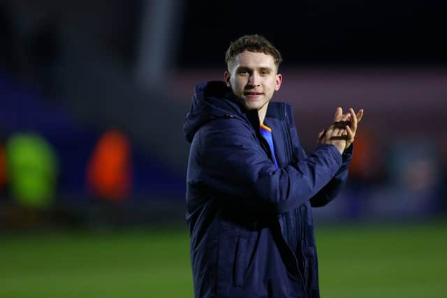 Iwan Morgan applauds the Shrewsbury Town supporters