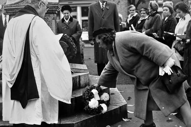 Laying a wreath at Broseley war memorial on Sunday, November 13, 1966 for Armistice Day.