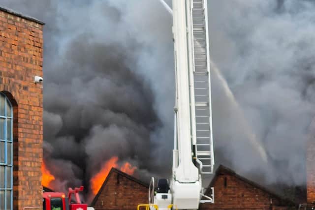 Crews are battling the blaze at a unit at the junction of Sunbeam Street and Upper Villiers Street