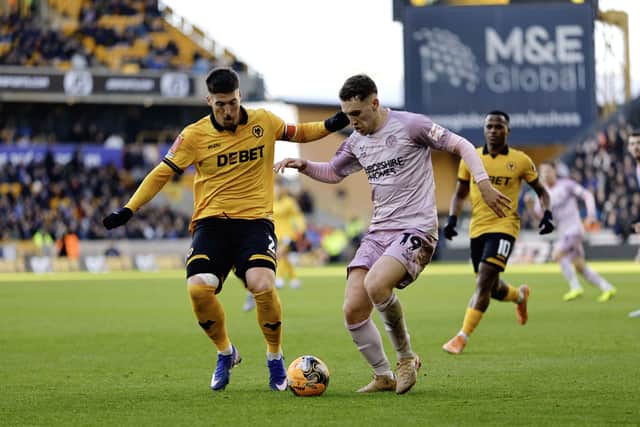 Iwan Morgan competes with Matt Doherty during the FA Cup 3rd round game between Wolverhampton Wanderers and Shrewsbury Town at Molineux on 10th January 2026