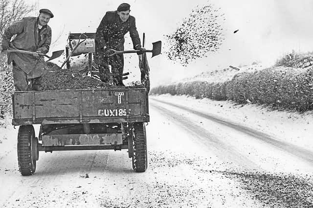 Montford Bridge, January 17, 1955: 'Despite hard work by road gangs, Shropshire roads were treacherous yesterday. The A5 on the Welsh side of Shrewsbury was particularly bad. These men were spreading grit at Montford Bridge, near Shrewsbury,' read the caption.