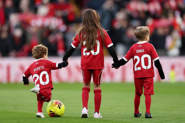 Jota's children on the pitch before the game (Photo by Jan Kruger/Getty Images)
