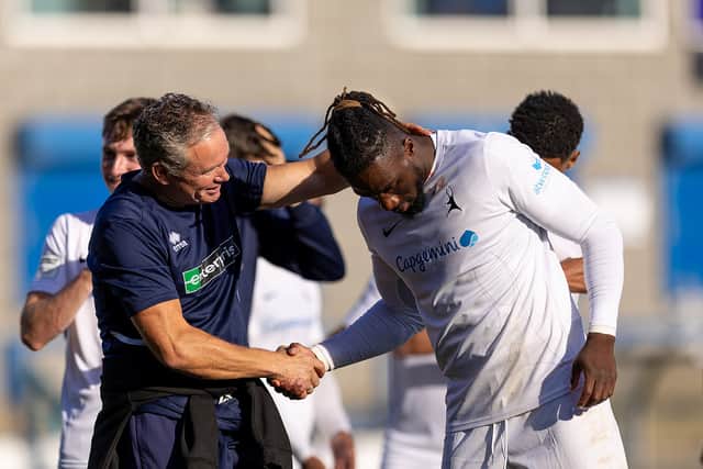 Boss Kevin Wilkin, congratulates AFC Telford defender Orrin Pendley after the FA Cup win over Kidderminster Harriers, which featured Pendley's wonderful bicycle kick goal. Pic: Euan Manning Photography