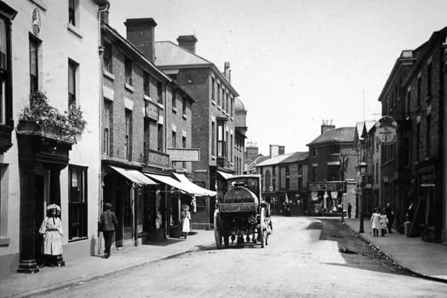 High Street, Wem. Shops include Mortons on the left, and Jarvis Ironmongers on the right. This postcard was franked on September 11, 1922. From the collection of Ray Farlow.
