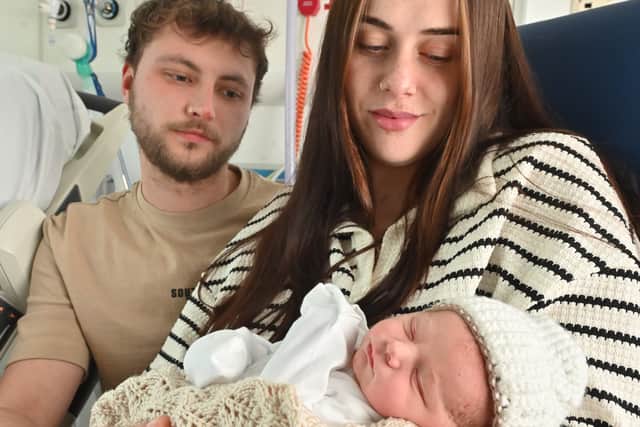 Molly and Chris Fazey with their new baby Luca. Photo: Steve Leath
