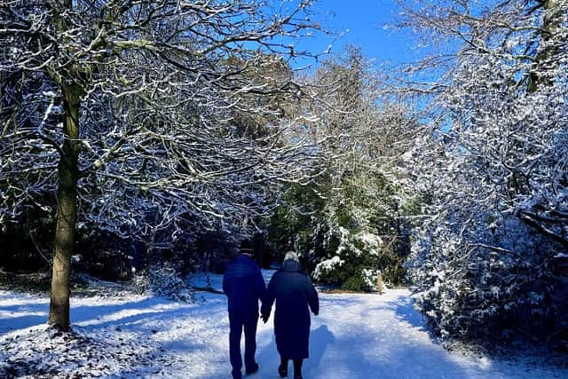 A couple take a stroll in the snow in Ellesmere. 