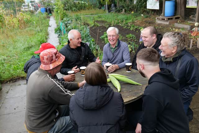 John Richards and Steve Bull joined Robert Plant in a visit to the allotment run by the Foundation's Head 4 Health participants.