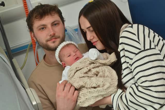 Molly and Chris Fazey with their new baby Luca. Photo: Steve Leath