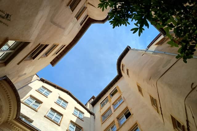 The view looking up from one of Lyon's traboules, the many passageways linking the city's old thoroughfares