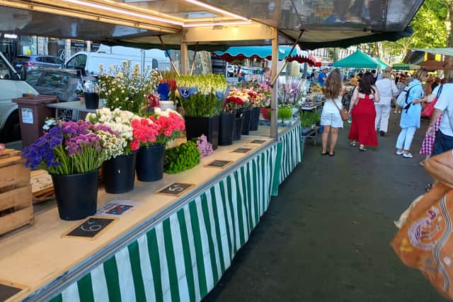 A colourful street market beside the River Seine