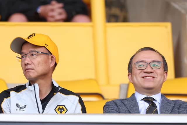 Executive chairman Jeff Shi (right) and owner of Wolves Guo Guangchang
