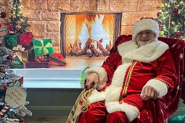 Resident Alan Bowater as Santa at HC-One’s Sedgley Court Care Home’s Christmas candy cane cavern
