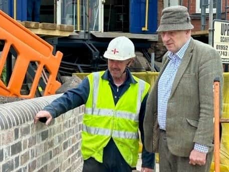 Dr Malvern Tipping with cliff railway engineer Barry Evans inspecting the retaining wall