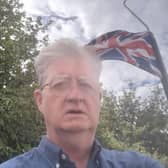 Councillor Julian Dean in front of a Union flag. He described the raising of flags on lamp posts in Shrewsbury as part of an "intimidatory campaign"