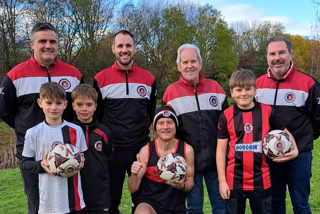 Back row, from left: Jon Tudge, Under-15 Girls Whites Manager, Mike Walters, Under-11s Reds Manager and Treasurer, Keith Davies, walking footballer, Dan Broster, Under-12s Blacks Manager and Junior Chair. Front row: George Walters and Frankie Tudge, Under-11s Reds Players, Tim Nash and Harvey Broster,