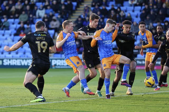 George Lloyd of Shrewsbury Town scores a goal to make it 1-0