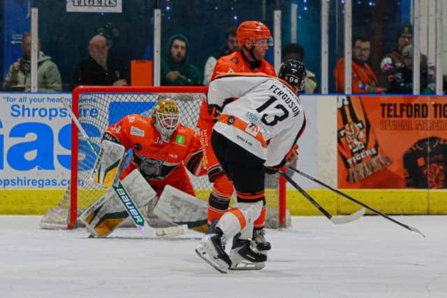Tigers man of the match Harry Ferguson gets an effort away. Pic: Edward Bowen / ebphotography