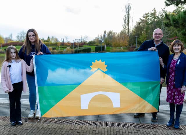 Amelia and mum Jayne (left) with Councillor Lee Carter and Councillor Angela McClements and the new Telford flag