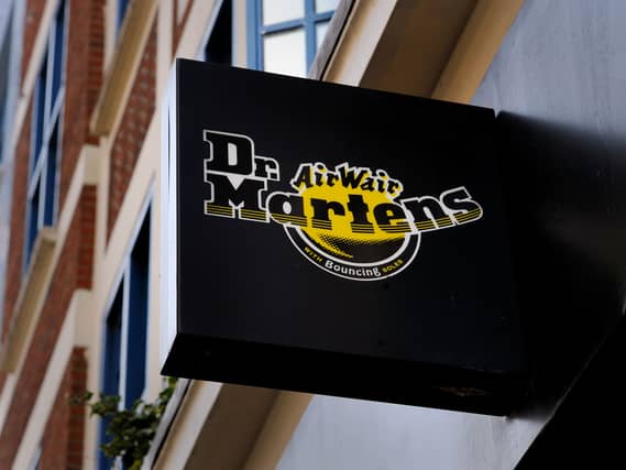 Dr Martens has revealed annual profits slumped as sales came under pressure and it cautioned over ongoing falling revenues in the UK.