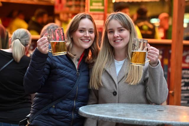 Lowri and Bethan from Aberystwyth enjoy a beer at the market in 2025