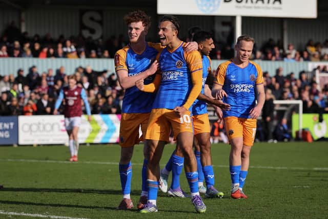 Tom Sang of Shrewsbury Town celebrates after scoring a goal to make it 3-0 with team-mate Tommy McDermott