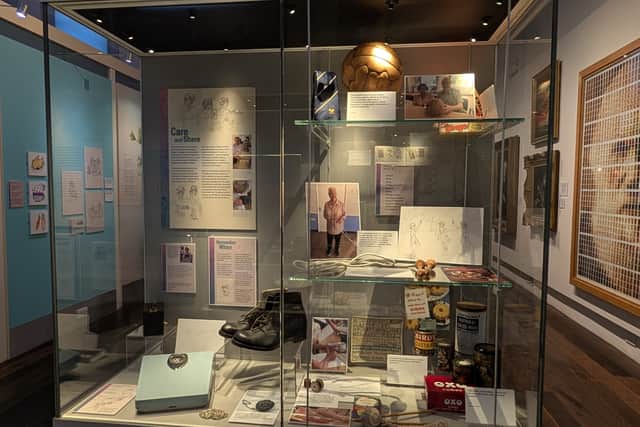 Cabinet of nostalgic items featured in the More Than Memories exhibition at Shrewsbury Museum.