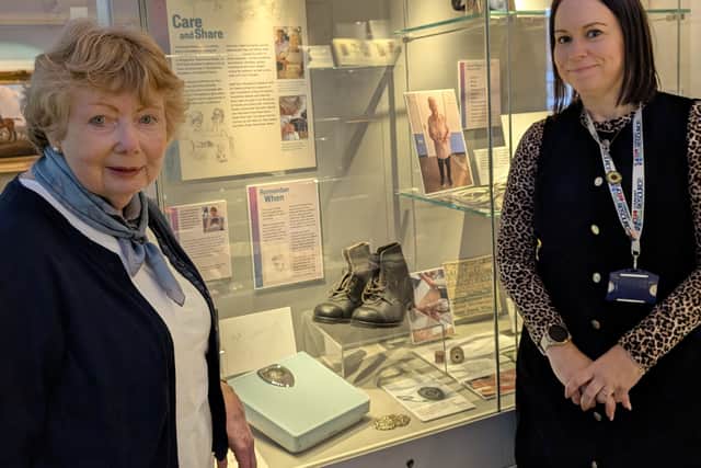 Linda Tivenan (left) with Nickie Long, Facilitator of Community Resource’s Shrewsbury Care and Share group, pictured during the ‘More Than Memories’ exhibition at Shrewsbury Museum and Art Gallery.