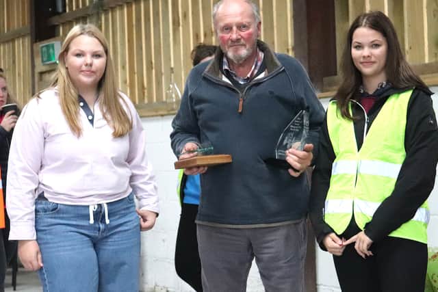Corah and her grandfather Hayden Millward being presented with the award for the best modern tractor
