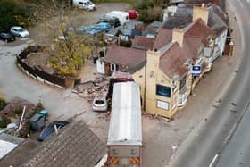 The lorry driver had to be cut free after the vehicle ploughed into the buildings. Picture: Jamie Ricketts