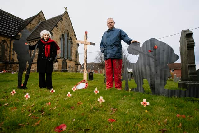 2020: 'A display of soldiers and poppies has been installed outside of St Matthews Church in Donnington, Telford, to mark Remembrance Day.' Pictured are Rev Paul Smith (left) and Curator Jon Rodwell