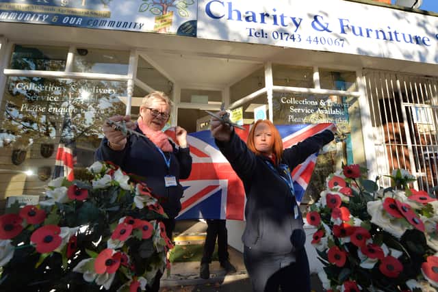 Putting on a display for Remembrance Day in 2021, (left) volunteer Jenny Davies, and (right) manager Beckie Lenton, at The Rural Charity, Whitchurch Road, Shrewsbury